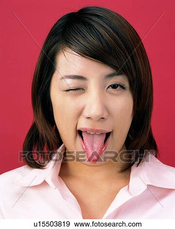 Young Woman Putting Out Her Tongue, Front View, Looking at Camera View Large Photo Image Stock Photo - Young Woman Putting Out Her Tongue, Front View, Looking at Camera. Fotosearch