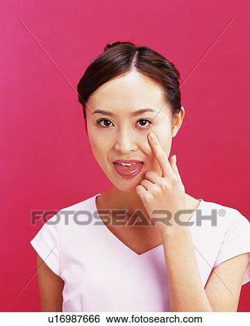 Young Woman Putting Out Her Tongue, Front View, Looking at Camera View Large Photo Image Stock Photograph - Young Woman Putting Out Her Tongue, Front View, Looking at Camera. Fotosearch