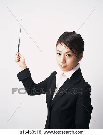 Businesswoman explaining with pointer, Studio, Portrait View Large Photo Image Stock Photo - Businesswoman explaining with pointer, Studio, Portrait. Fotosearch