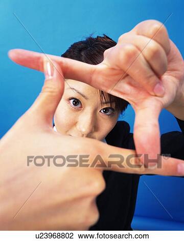 Businesswoman making frame with fingers, Studio, Portrait View Large Photo Image Stock Image - Businesswoman making frame with fingers, Studio, Portrait. Fotosearch