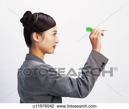 Businesswoman playing darts, Studio, Portrait View Large Photo Image Stock Image - Businesswoman playing darts, Studio, Portrait. Fotosearch