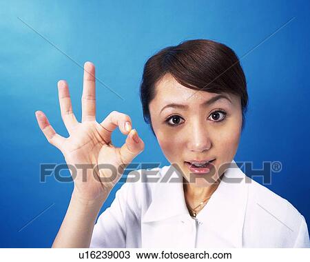 Businesswoman smiling with finger sign, Studio, Portrait View Large Photo Image Stock Image - Businesswoman smiling with finger sign, Studio, Portrait. Fotosearch