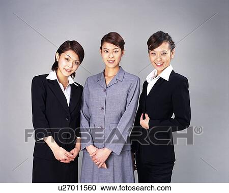 Three Businesswomen standing, smiling at camera, Studio, Portrait View Large Photo Image Stock Image - Three Businesswomen standing, smiling at camera, Studio, Portrait. Fotosearch