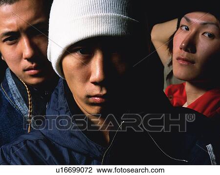 Group of three young adult men looking at camera, Studio View Large Photo Image Stock Image - Group of three young adult men looking at camera, Studio. Fotosearch