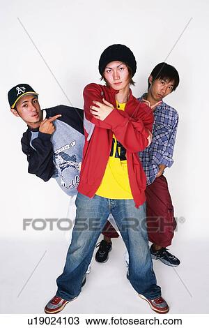 Group of three young adult men poing, studio View Large Photo Image Stock Image - Group of three young adult men poing, studio. Fotosearch