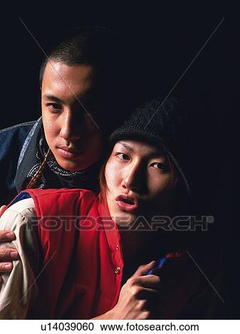 Group of two young adult men looking at camera, Studio View Large Photo Image Stock Image - Group of two young adult men looking at camera, Studio. Fotosearch