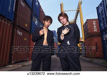 Group of two young adult men posing, Outdoors View Large Photo Image Stock Image - Group of two young adult men posing, Outdoors. Fotosearch