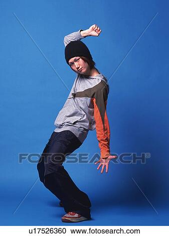 Stock Image - Young adult man dancing, Studio, Portraint. Fotosearch