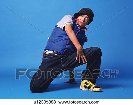 Young adult man dancing, Studio, Portraint View Large Photo Image Stock Photo - Young adult man dancing, Studio, Portraint. Fotosearch