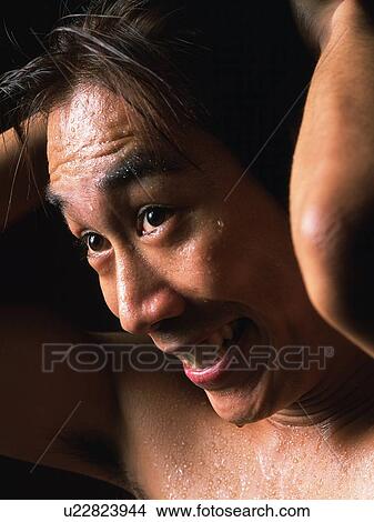 Picture - Young adult man sweating, Close Up, Portraint. Fotosearch