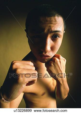 Young adult man with fighting pose, Waist Up, Portraint View Large Photo Image Stock Photo - Young adult man with fighting pose, Waist Up, Portraint. Fotosearch