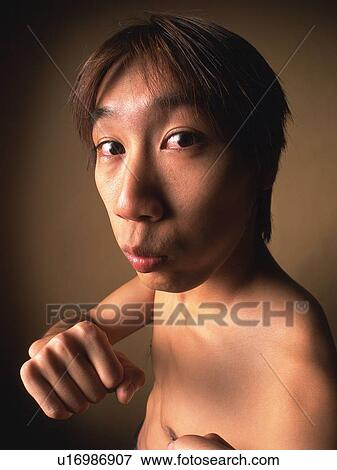 Young adult man with fighting pose, Head and Shoulders, Portraint View Large Photo Image Stock Photo - Young adult man with fighting pose, Head and Shoulders, Portraint. Fotosearch