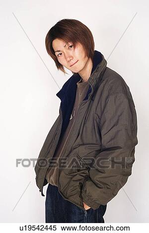 Stock Photography - Young adult man with jumper on, Studio, Portraint. Fotosearch