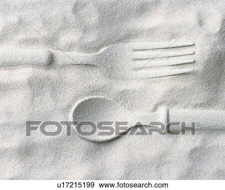 Stock Photo - Sand Craft of Fork and Spoon, High Angle View. Fotosearch