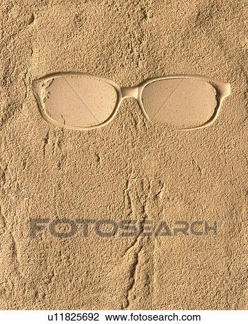 Stock Image - Sand Craft of Glasses, High Angle View, Copy Space. Fotosearch