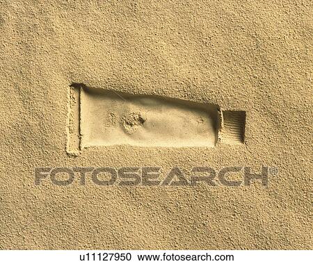Stock Image - Sand Craft of Paint Tube, High Angle View. Fotosearch