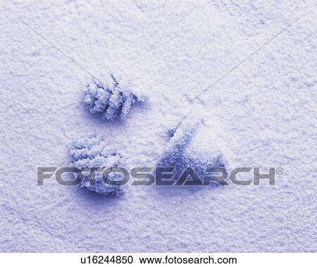 Stock Image - Sand Craft of Pine Cone and Bell, High Angle View. Fotosearch