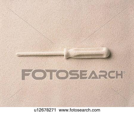 Stock Image - Sand Craft of Screwdriver, High Angle View, Copy Space. Fotosearch
