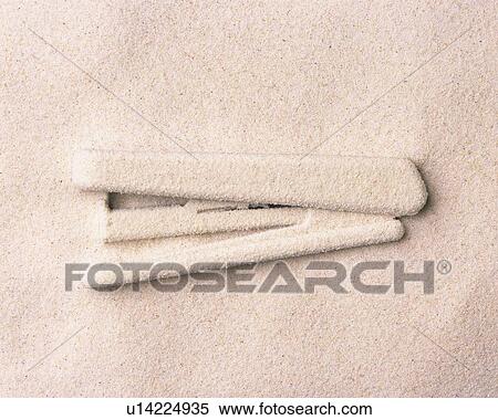 Stock Photography - Sand Craft of Stapler, High Angle View, Copy Space. Fotosearch
