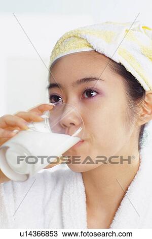 Closed Up Image of a Young Adult Woman Drinking Milk in her Bathrobe, Side View, Low Angle View View Large Photo Image Stock Image - Closed Up Image of a Young Adult Woman Drinking Milk in her Bathrobe, Side View, Low Angle View. Fotosearch