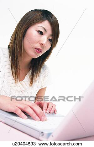 Closed Up Image of a Young Adult Woman Operating her Laptop, Side View, Low Angle Vie View Large Photo Image Stock Image - Closed Up Image of a Young Adult Woman Operating her Laptop, Side View, Low Angle Vie. Fotosearch