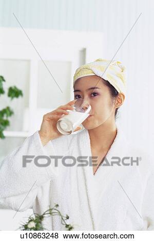 Young Adult Woman Drinking Milk in her Bathrobe, Low Angle View View Large Photo Image Stock Photo - Young Adult Woman Drinking Milk in her Bathrobe, Low Angle View. Fotosearch