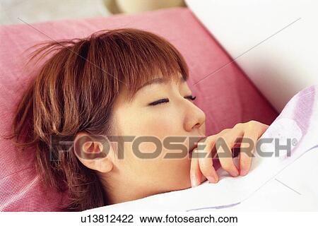 Young Adult Woman Sleeping on a Pink Pillow, High Angle View View Large Photo Image Stock Image - Young Adult Woman Sleeping on a Pink Pillow, High Angle View. Fotosearch