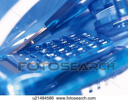 Calculator and scissors in blue View Large Photo Image Stock Photograph - Calculator and scissors in blue. Fotosearch