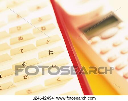 Picture - Close up of address book and phone. Fotosearch
