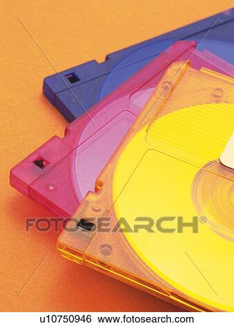 Stock Photograph - Close up of three piled up colorful MOs . Fotosearch