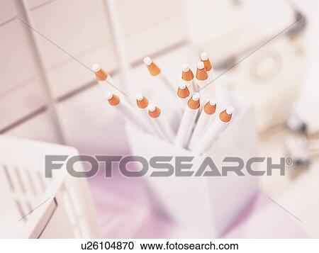 Colored pencils in penholder and desk equipment in white View Large Photo Image Stock Image - Colored pencils in penholder and desk equipment in white. Fotosearch