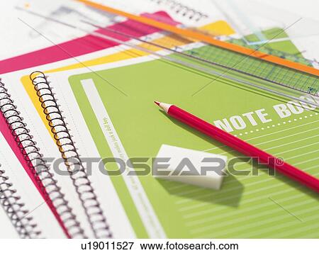 Colorful stationeries piled on desk View Large Photo Image Stock Photo - Colorful stationeries piled on desk. Fotosearch