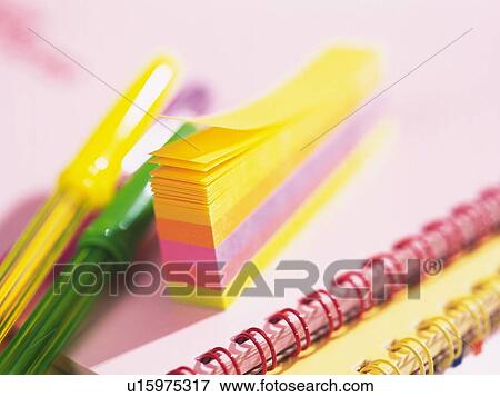 Stock Photo - Colorful sticky and pens on notebook. Fotosearch