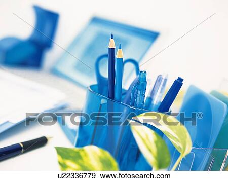 Laptop and stationeries in blue on desk View Large Photo Image Stock Photo - Laptop and stationeries in blue on desk. Fotosearch
