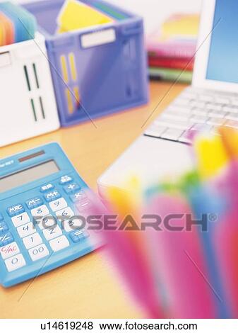 Laptop and stationeries on desk View Large Photo Image Stock Photo - Laptop and stationeries on desk. Fotosearch