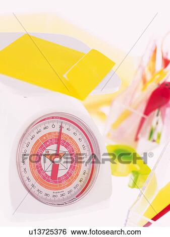 Yellow envelope on weighing scale View Large Photo Image Stock Photograph - Yellow envelope on weighing scale. Fotosearch