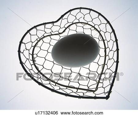 Egg in heart shaped basket, high angle view, colored background View Large Photo Image Stock Photograph - Egg in heart shaped basket, high angle view, colored background. Fotosearch