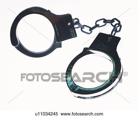 Handcuffs, high angle view, white background View Large Photo Image Stock Photography - Handcuffs, high angle view, white background. Fotosearch