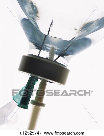 Needles of intravenous drip sticking into bottle, side view, close up, white background View Large Photo Image Stock Photo - Needles of intravenous drip sticking into bottle, side view, close up, white background. Fotosearch