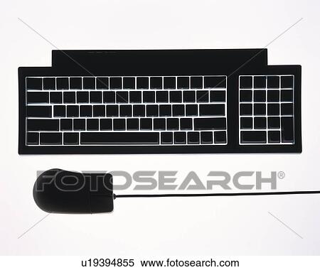 Stock Photography - Silhouette of computer keyboard and mouse, high angle view, white background. Fotosearch