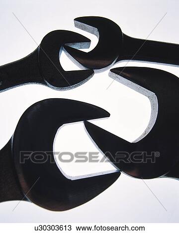 Stock Image - Silhouette of four spanners, high angle view, white background. Fotosearch