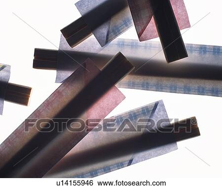 Stock Photograph - Silhouette of Japanese disposable chopsticks, high angle view, white background. Fotosearch