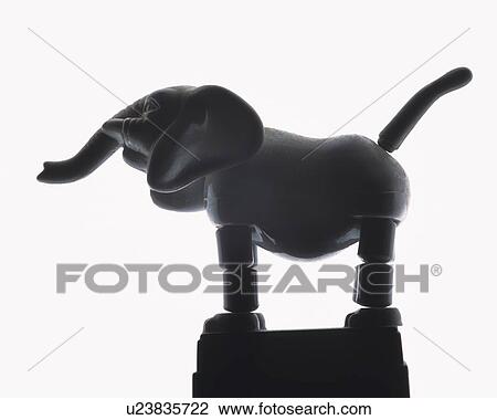 Silhouette of toy elephant, side view, white background View Large Photo Image Stock Image - Silhouette of toy elephant, side view, white background. Fotosearch
