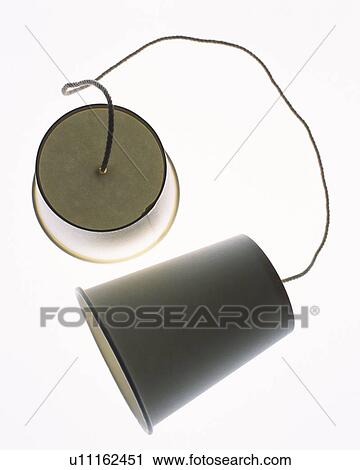 Stock Image - String telephone, high angle view, close up, white background. Fotosearch