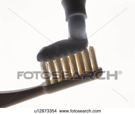 Toothpaste on toothbrush, side view, white background View Large Photo Image Picture - Toothpaste on toothbrush, side view, white background. Fotosearch