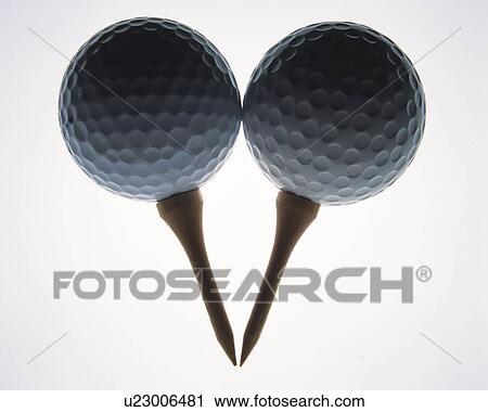 Two golf balls on pins, front view, white background View Large Photo Image Stock Image - Two golf balls on pins, front view, white background. Fotosearch