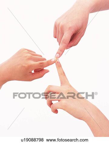 Stock Photo - Finger tips of three people touching each other. Fotosearch