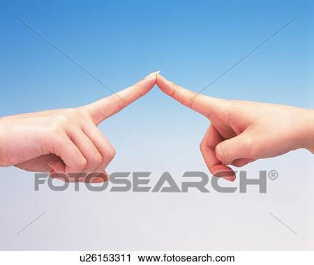 Finger tips of two women touching each other View Large Photo Image Stock Image - Finger tips of two women touching each other. Fotosearch