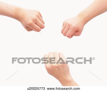Stock Image - Fists of three people. Fotosearch