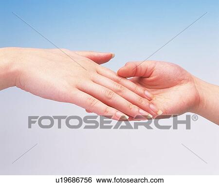 Hands of two women, one supporting the other View Large Photo Image Stock Photograph - Hands of two women, one supporting the other. Fotosearch